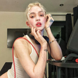 Grimes’ Face Tattoo: Photo, Meaning